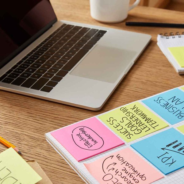 paper-stickers-with-business-strategy-and-laptop-o-KGQHWUL.jpg